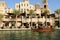 View of the Souk Madinat Jumeirah and tourists swimming on abra boat