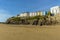 A view from the South Beach towards the colourful cliff top hotels in Tenby, Pembrokeshire