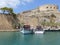 View of Spinalonga fortress and tourist boats, Crete, Greece