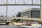 View of Spree River at Paul Loebe building on sunny summer with city sightseeing tour cruise boats and crowd of people on bridge