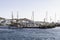 View of the spur and mooring of several sailboats and yachts on one of the islands of the Cyclades archipelago, Greece