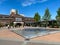 View on square of exterior shopping mall in summer with blue sky