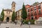 View at the St. Ana square with San Gil and Santa Ana Church, heritage colored buildings and Carrera del Darro to the street sad