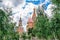 View of St. Basil`s Cathedral with green trees - the main popular attraction of Moscow from the Zaryadye park
