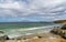 View of St. Ives Bay and small beach near Gwithian with the Godrevy Lighthouse in the background