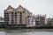 View of St. John`s Wharf, a warehouse converted into residential flat, from River Thames, London, UK