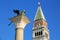 View of St Mark`s Campanile and Lion of Venice statue at Piazzetta San Marco in Venice, Italy