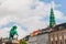 View of St Nicholas church tower and statue of Bishop Absalon, Copenhagen, Denmark