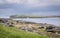 A view of Staffin island and Staffin harbour. Garrafad bay and An Corran Beach.  fishing boat and cottage