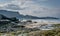 A view of Staffin island and Staffin harbour. Garrafad bay and An Corran Beach. People on the beach searching for dinosaur