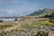 A view of Staffin island and Staffin harbour. Garrafad bay and An Corran Beach. People on the beach searching for dinosaur