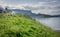 A view of Staffin island and Staffin harbour. Garrafad bay and An Corran Beach.  Seaweed on the beach.  sheep grazing on a cliff