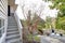 View of the stairs and roof top deck over garage