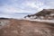 View of steam emitting from volcanic crater in geothermal area of Hverir