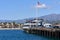 A view of Stearns Wharf, Santa Barbara, with the beach and mountains behind