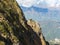 View of a steep cliff near with a suspension bridge over a mountain abyss