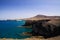 View on steep rugged cliffs of coast of Punta del Papagayo, Playa Blanca - Lanzarote