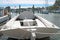 View from the stern of a fishing boat docked in a harbor