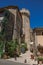 View of stone houses, castle tower and narrow alley in the historical city center of Gordes.
