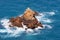 View of the stone islet near the Atlantic Ocean coast in Morocco in sunny day