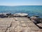 View from the stone pier to the sea and clear blue sky