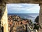 A view through the stone window of the Minceta Tower or Fortress looking out at the old town and walls of Dubrovnik