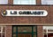 View on store facade with logo lettering of le creuset french kitchen products