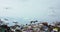 View of stork flock flying above waste dump on bright sky horizon