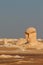 View of strange rock shapes due to erosion in White Desert close to Farafra oasis in Egypt.