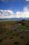 View of the stream flowing through the steppe with mountains covered in snow. Kurai steppe, Altai, Siberia, Russia