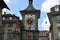 View from the street on east front of medieval Clock Tower, Zytglogge, in town Bern in Switzerland.