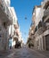 View of street leading to the sea at the coastal town of Polignano a Mare in Puglia, Southern Italy.