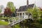 View of the street and traditional dutch wooden bridge in fishing village