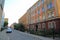 View of street of Uppsala, Sweden, Europe. Red buildings on blue sky background