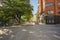 View of street of Uppsala, Sweden, Europe. Red buildings on blue sky background.