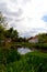 View of a stretch of water with a farm.