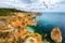 View of stunning beach with golden color rocks in Alvor town , Algarve, Portugal. View of cliff rocks on Alvor beach, Algarve