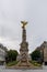 View of the Sube Fountain statue with the golden angel in downtown Reims