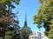 View of summer street with high spire of buildings in Tallinn. Estonia