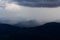 View at the summit of Mor La Ah Mountain with the rain falling far away. Located in the Karen District of KNU