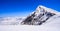 View of Summit of Mount Jungfrau Jungfraujoch with cloud and blue sky background, Jungfraujoch Railway Station, Bernese Oberland