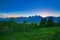 View of the sun setting on the Grand Teton mountain range