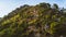 A view of sunlit summer mountain covered by forests against blue clear sky, Budva, Montenegro