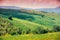 View of sunny fields on the hills in Tuscany, Italy