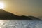 View of a sunset over Aegean Sea Greek islands. Hills silhouette