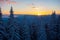 View of the sunset over Capatani Mountains seen from Mount Cozia