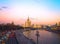 View of the sunset on the river, a residential skyscraper on Kotelnicheskaya Embankment, Moscow River, Bolshoy Ustinsky bridge. Mo