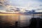 View of the sunset from the ship underway and in the port. Colorful views of the surface of the water and the sky with clouds.