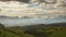 View of a sunset with very cloudy sky over cultivated fields in the area near the village of Checa