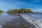 A view of surf breaking in front of Saint Catherine`s Island in Tenby, Pembrokeshire